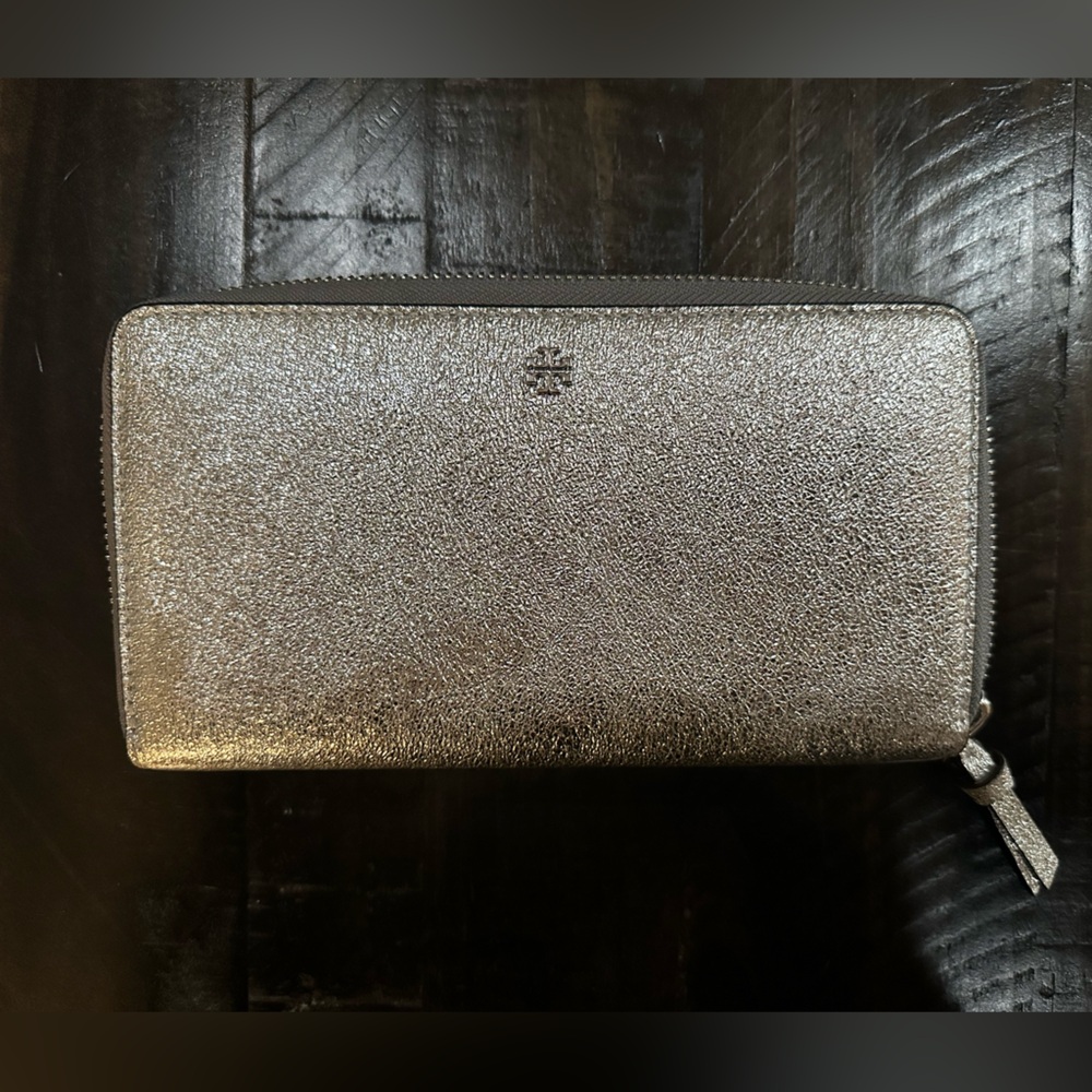 Tory Burch brand new zip around metallic silver wallet.